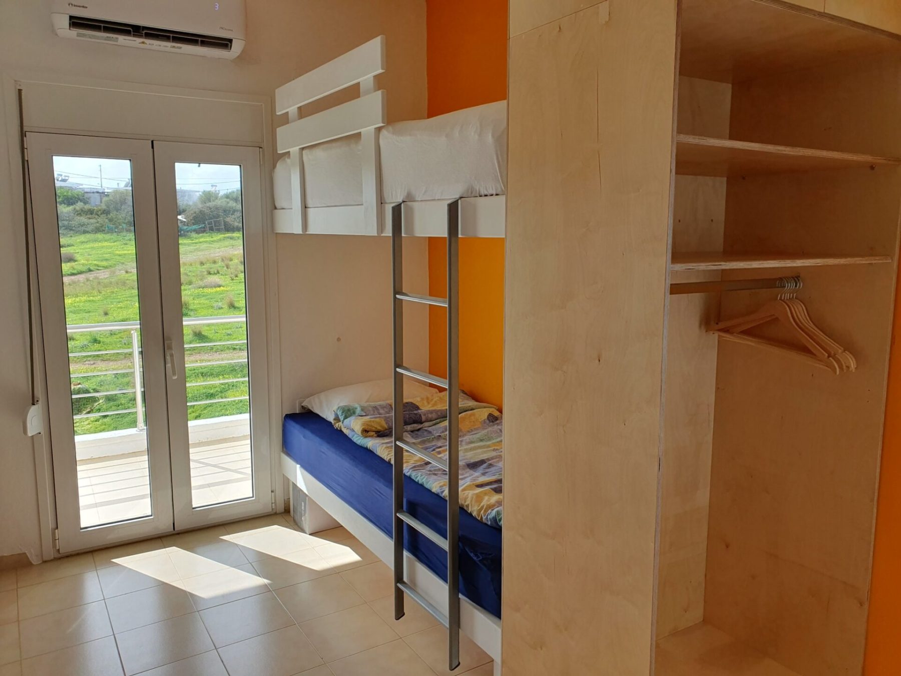 The new 2 stories beds (90 x 200 cm) and the wardrobe case.